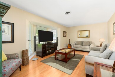 Located right off the front entry is the home's spacious living room! Freshly painted and upgraded with 