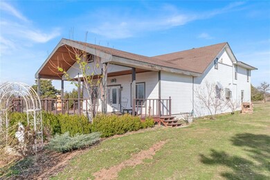 Back of house with a yard