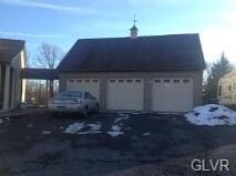 Spacious 3 car garage w/2nd level for extra storag