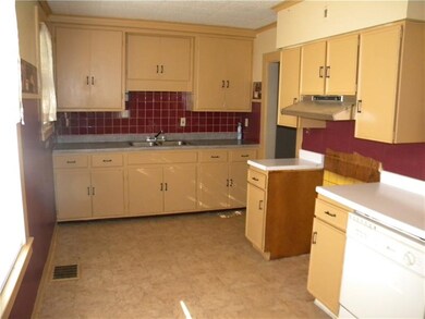 Kitchen just off the mud room which leads to priva