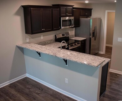 Kitchen with a kitchen breakfast bar, appliances w