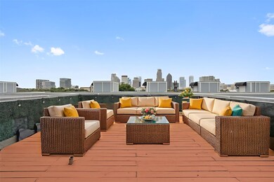 Wooden terrace featuring an outdoor hangout area and a skyline view