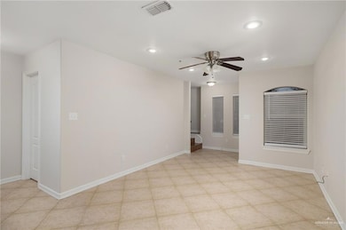 Spare room with ceiling fan