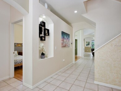 Lovely foyer, featuring decorative niches and arch