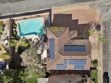 Aerial view of this corner lot and pool area