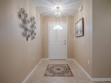 LOVELY DECORATIVE TILED FOYER AND TRANQUIL COLORS INVITE YOU IN TO THIS HOME!