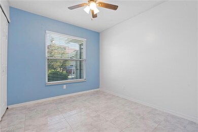 Tiled spare room with ceiling fan