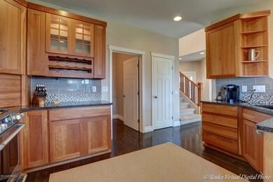 Granite counters & glass tile backsplash