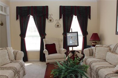 Abundant natural lighting in the formal living are
