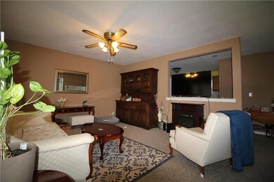 Comfortable, large living room area with ceiling f