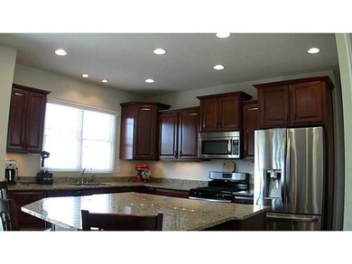 Kitchen. Custom island with HUGE granite slab addi