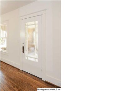 Original front door with mostly original glass.