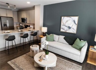 Living room featuring dark wood-type flooring, sin