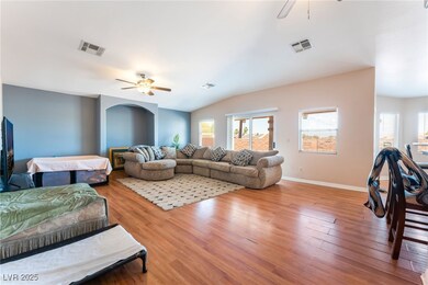 4656 E DI Living area featuring a ceiling fan, woo