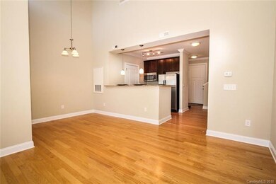 Kitchen and bar opens to dining and living area