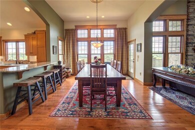 Dining room with hardwood floors, floor to ceiling