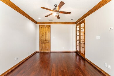 Study has double french doors that overlook the en