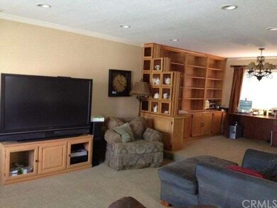 Familyroom area with built in book shelves and buf