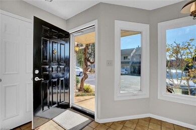 Freshly painted door and large coat closet as you enter to the right.