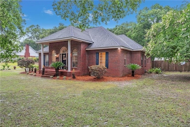 View of front of property with brick siding and roof with shingles