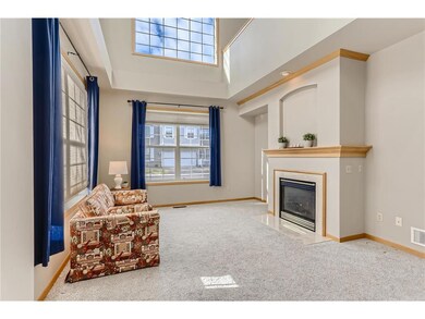Stunning living room with soaring ceiling and beau