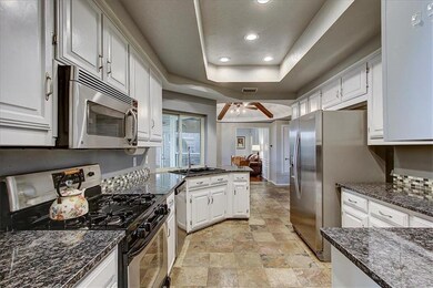 Granite counter tops, gas range, and pass through 