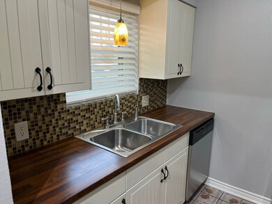 kitchen with wood countertops, window faces east, great sun in morning.