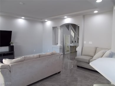 Living area with decorative columns, recessed ligh