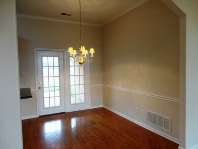 Dining with hardwoods- opens to covered patio