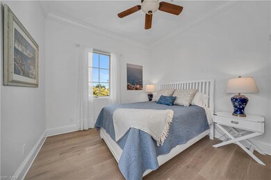 Bedroom featuring french oak hardwood / wood-style