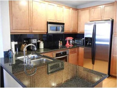 Upgraded kitchen with granite countertops and back