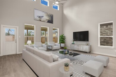 Gather the family and guests together in your lovely living room! Featuring soaring high ceilings, recessed lighting, dark stained ceiling fan, custom paint, gorgeous floors, and large windows that provide plenty of natural lighting throughout the day.
