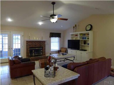 Another angle of great room. French doors lead to the screened porch and backyard.
