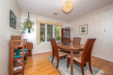 Dining room with hardwood flooring and big windows