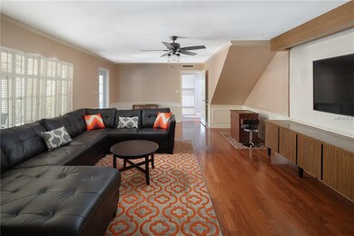 Informal living room/family room off the pool and 