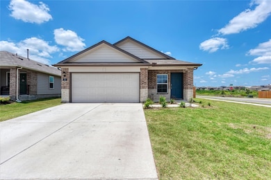 View of front of property with a front lawn, conc