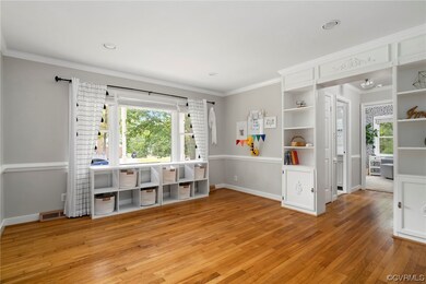 Interior space featuring crown molding and light h
