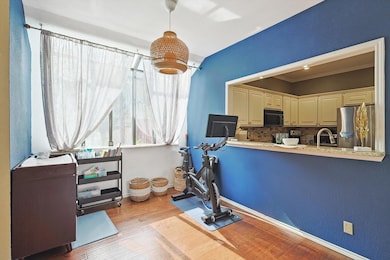 Exercise room featuring sink, ornamental molding, 