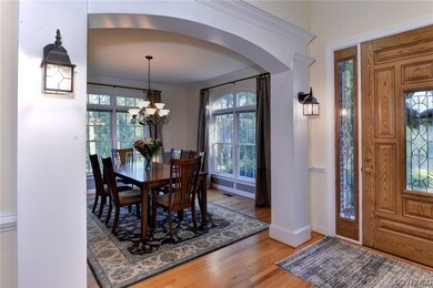 View of the oversized front door and formal dining