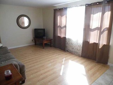 Living Room. New window & ceramic tile entryway.
