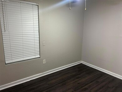 Unfurnished room featuring dark wood-type floorin