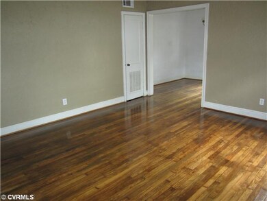 Living Room - View of the living room from the front door, you can see the dining room off to the right.