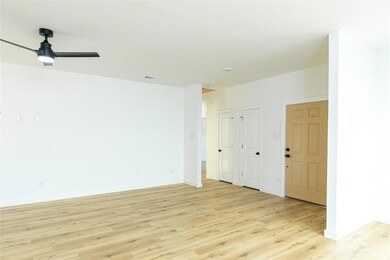 Empty room featuring light hardwood / wood-style f