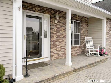 Porch - Open. Enjoy the large covered front porch, brick paver walkway and nice landscaping.