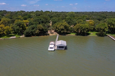 Bird's eye view of a nearby body of water and a forest