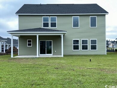 Rear view of house with a yard