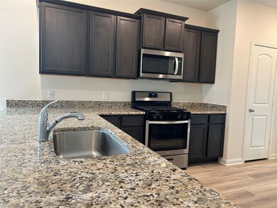 Pretty Granite countertops elevate the property