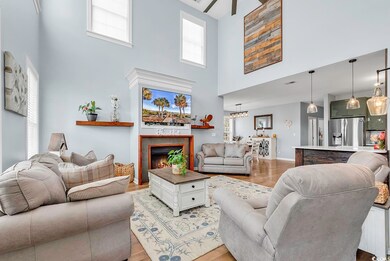 Living room with a towering ceiling and light hard