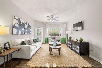 Living room with ceiling fan, dark hardwood / wood