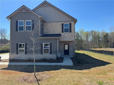 View of front of property with brick siding, board